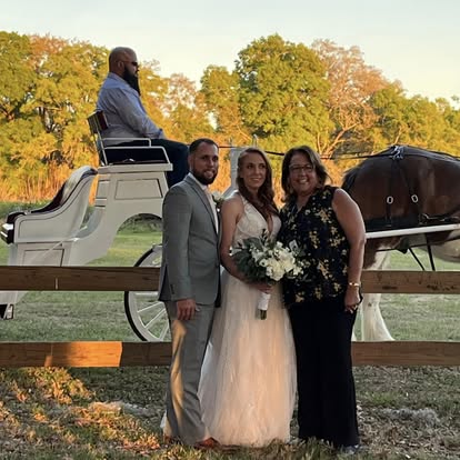 Esther and newlyweds beside a horse-drawn carriage