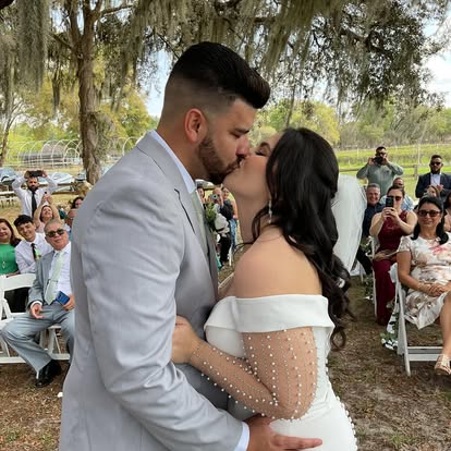 A couple sharing a kiss after their vows