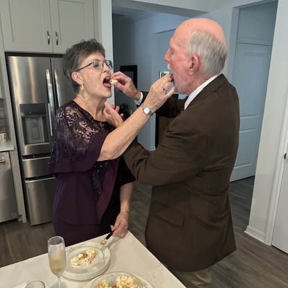 A couple sharing cake at their wedding celebration