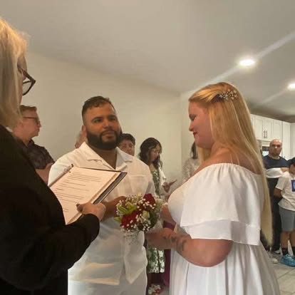 A couple exchanging vows indoors