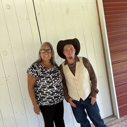 Esther with a groom wearing a cowboy hat